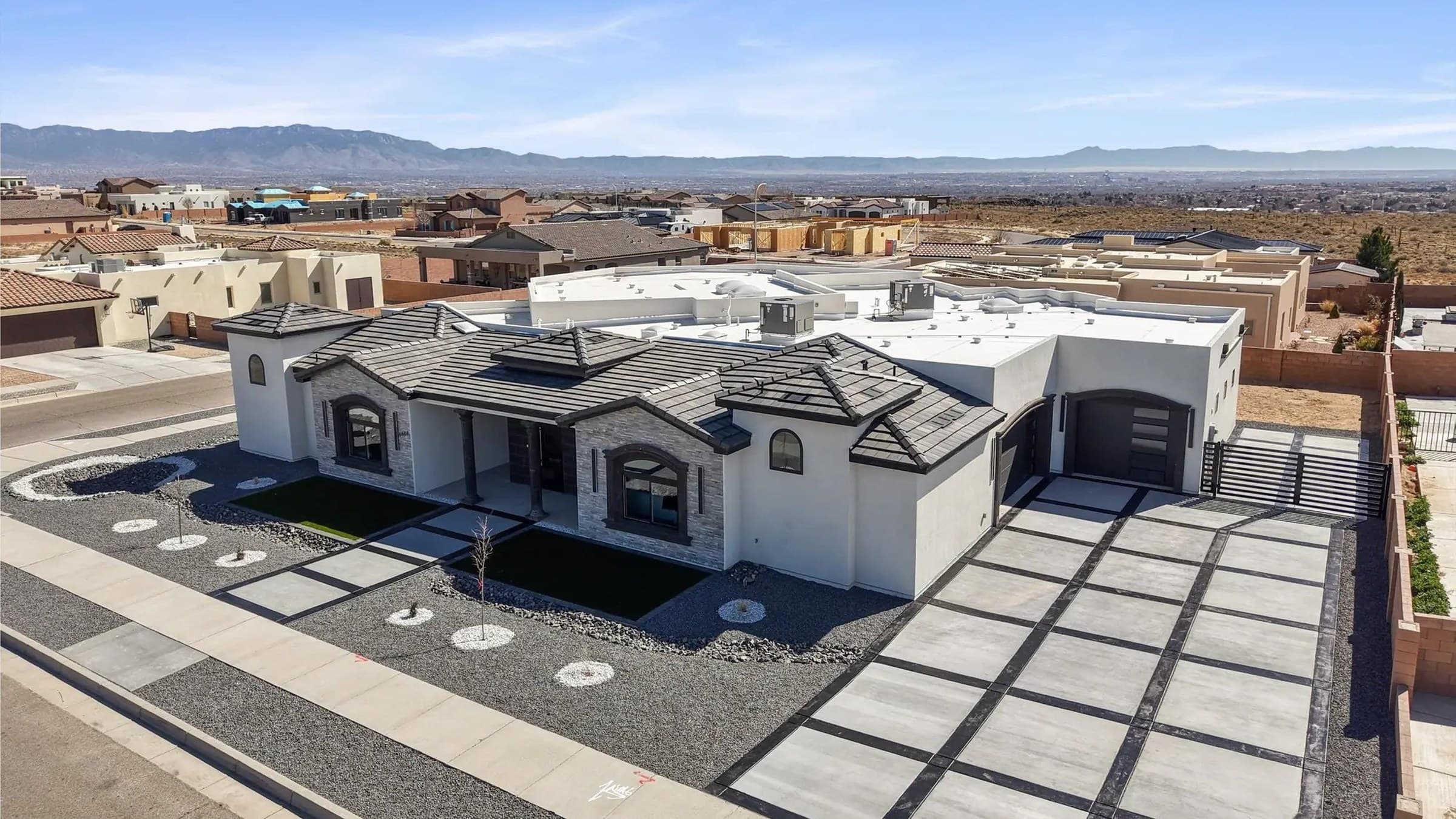 Modern Southwest Contemporary homes in Petroglyph Estates, Northwest Albuquerque, with the Sandia Mountains beyond